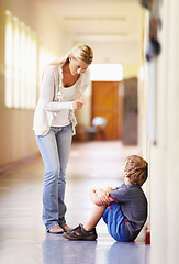 Image showing Teacher, school and scolding child student for bad behaviour, problem or learning lesson. Frustrated woman pointing to punish boy for discipline, pedagogy or fail in education building hallway