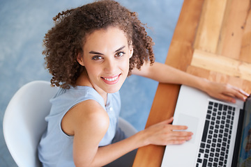 Image showing Top view, portrait and woman with a laptop, business and keyboard with typing, startup success and new project. Face, female employee and consultant with a pc, technology and search internet for info