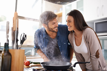 Image showing Food, love and happy couple in kitchen cooking, smile and preparing lunch in their home together. Dinner, date and man with woman excited, hungry and cheerful for meal preparation in their apartment