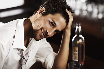 Image showing Bar counter relax man and portrait of happy hour with alcohol and whiskey after work. Bottle, young male person and hand in hair in a restaurant with a playboy guy with a glass and confidence in pub