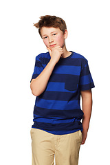 Image showing Children, portrait and thinking with a boy in studio isolated on a white background standing hand on chin. Kids, idea and problem solving with a young male child contemplating a thought or solution