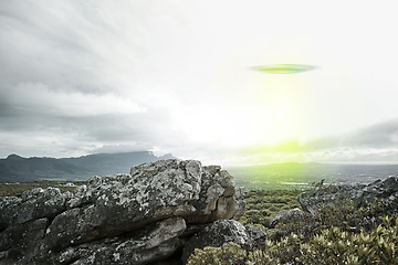 Image showing UFO, sky and spaceship with lights over mountain for extraterrestrial, surreal or alien invasion. Spacecraft, war or world domination by drone in flight in nature for fantasy or outer space abduction