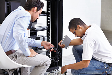 Image showing Server room, man or technician fixing electronics for hardware maintenance or working on glitch in office. IT support or worker with an electrician or electrical engineer for information technology