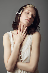 Image showing Natural beauty, fashion and woman with eyes closed in studio isolated on a gray background. Beautiful, vintage clothes and female model with retro style, headband and skincare for healthy skin.