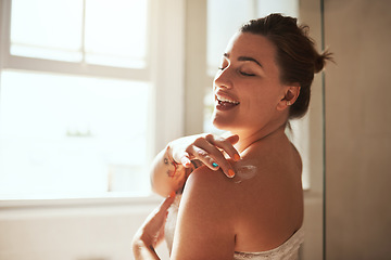 Image showing Skincare, cream and woman in bathroom for wellness, moisturizer and apply lotion for healthy skin. Beauty, self care and female person touch body for grooming, hydration and cosmetics for hygiene