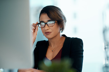 Image showing Computer, glasses and business woman reading report, online research or article, news and data analysis. Focused african person or professional worker with website editing or analytics on desktop pc