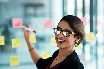 Image showing Creative woman, portrait and writing on glass moodboard for ideas, brainstorming workflow or project priority. Business, biracial person with sticky notes and schedule, planning and creative solution