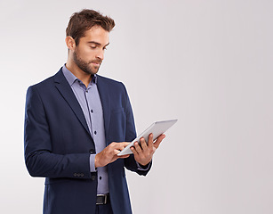 Image showing Business man with tablet, technology or corporate communication isolated on studio background. Internet, connectivity or networking professional, male worker or check email for career on mockup space