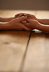 Image showing Love, support and closeup of people holding hands for grief, hope and sympathy after loss. Gratitude, empathy and couple having intimate moment with affection for unity, trust and solidarity on table