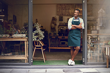 Image showing Thinking, coffee shop and man or small business owner at front door with a smile. Entrepreneur person as barista, manager or waiter in restaurant for service, career pride and startup goals
