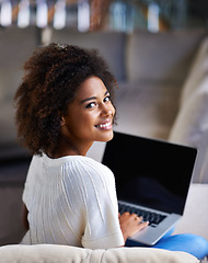 Image showing Portrait, smile and woman on a couch, laptop and connection for social media, happiness and relax at home. Face, female person and happy girl on a sofa, technology and search website for information