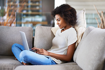 Image showing Relax, typing and woman on a couch, laptop and search website at home, happiness and network. Female person, model in a lounge and lady with technology, chilling and online reading on weekend break