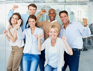 Image showing Business people, portrait and fist in celebration for success, winning or teamwork at office. Group of employees with smile in happiness for team win, victory or achievement for goals at workplace