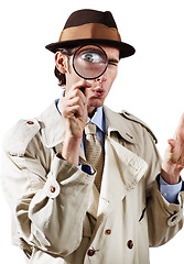 Image showing Private investigator, magnifying glass and portrait of man in studio for detective, searching and looking. Spy, investigation and male person with magnifier for secrets, information and mystery clue