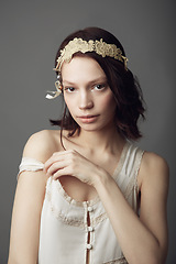 Image showing Fashion, natural beauty and portrait of woman in studio isolated on a gray background. Beautiful, vintage clothes and serious female model from Australia with retro style, headband and cosmetics.