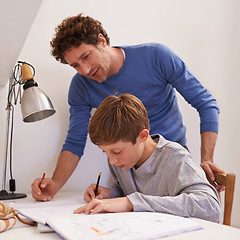 Image showing Education, father and son with homework, talking and learning at home, studying and writing. Family, happy dad and male child with books, knowledge and teaching for growth, development and lesson