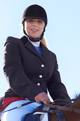 Image showing Equestrian, happy and portrait of woman on horse for competition, training and show. Performance, riding and fitness with female jockey on stallion for animal, athlete and contest event