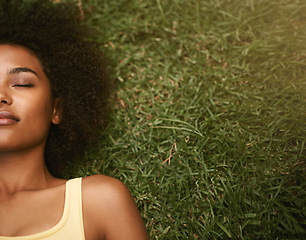 Image showing Sleep, grass and mockup with a black woman lying on a field from above for peace or quiet outdoor in nature. Dreaming, relax and zen with an attractive young female resting alone in the countryside