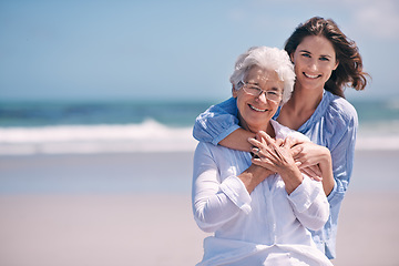Image showing Portrait, beach and young woman with her senior mother embrace and smile together outdoors on mockup. Family, happy and hugging elderly lady with adult daughter or at the ocean or sea for travel
