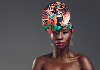 Image showing Portrait, head wrap and black woman with fashion, beauty and confident on a grey studio background. Face, female person and model with traditional turban, cosmetics and makeup with skincare or mockup