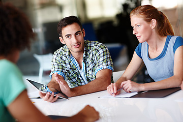 Image showing Business, meeting and employees planning, communication and brainstorming at the workplace. Coworkers, staff and group with discussion, share ideas and technology with a new project at the office