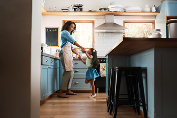 Image showing Happy, mother with child dancing in kitchen and at their home. Family with love, entertainment or comic and laughing female parent with daughter have fun together holding hands at their house