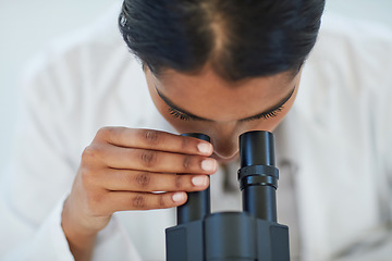 Image showing Science, medical research and female scientist with a microscope for analyzing microbiology in a lab. Healthcare, biotechnology and woman researcher working on a project in pharmaceutical laboratory.