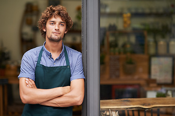 Image showing Door, arms crossed and thinking with man at cafe restaurant for small business, coffee shop or waiter. Entrepreneur, open and retail with male barista at restaurant for diner, store and food industry