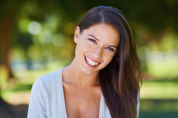 Image showing Face, smile and portrait of a woman happy in a park in summer for beauty, excited and confident in nature. Head, garden and female person or model outdoor with freedom, happiness and style