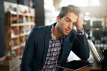 Image showing Stress, upset and businessman with a tablet in the office while working on a corporate project. Technology, migraine and professional male employee with a digital mobile for a report in the workplace