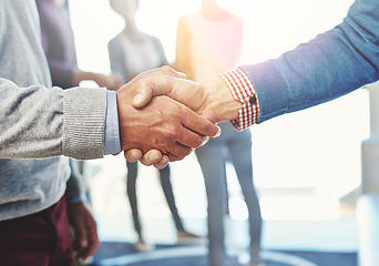 Image showing Closeup, hand shake and agreement for partnership in office with welcome, onboarding or b2b collaboration. Men, business and shaking hands for hiring, recruitment and congratulations in workplace