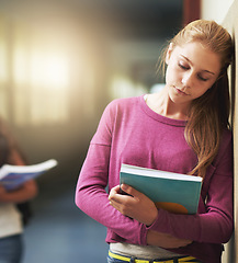 Image showing Girl, sad and school bullying with book, anxiety and depression from problem with students at academy. Young, teenager and upset with notebook and kids gossip in hallway, education and wall mock up