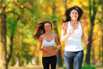 Image showing Wellness, nature and women training or running in a forest with mockup feeling happy and excited together. Health, fitness and female people or runner friends in exercise and workout in the woods