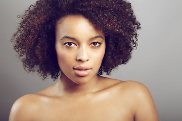 Image showing Serious, portrait and a black woman for skincare and beauty isolated on studio background. Wellness, dermatology and face of an African girl with a glow from care for skin and cosmetic salon results