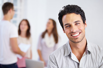 Image showing Happy, work and portrait of a man in an office with business people for commitment and our vision. Smile, working and face of a corporate employee at a company with workers at a professional agency