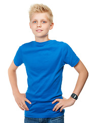 Image showing Children, fashion and a boy in studio isolated on a white background standing with his hands on hips. Kids, style and arms akimbo with a young male child in blue posing for casual lifestyle wear