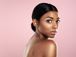 Image showing Serious face, skincare and woman in studio isolated on a pink background mockup space. Natural beauty, portrait and Indian female model with makeup, cosmetics or spa facial treatment for healthy skin