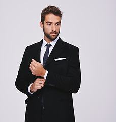 Image showing Business, thinking and man with ideas, suit and executive agent isolated against a grey studio background. Male person, thoughtful and entrepreneur with formal wear, trendy clothes and stylish outfit