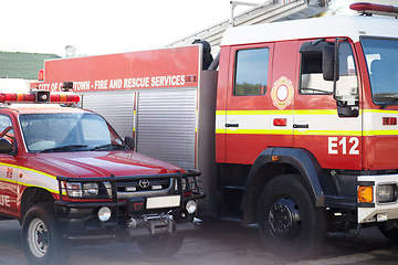 Image showing Fire engine, truck and rescue services at station ready for firefighting, emergency and transportation. Firefighter vehicles parked outside for safety, transport and equipment for brigade protection