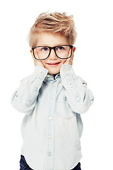 Image showing Cute, thinking and a little boy with glasses and a smile isolated on a white background. Happy, idea and a kindergarten child with student eyewear for intelligence and fashion on a studio backdrop