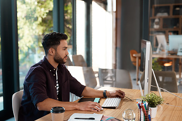 Image showing Office, designer and man working on computer at desk while online for research or creative work. Male entrepreneur person at workplace with internet connection for business project or reading email