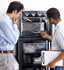Image showing Information technology, men and wire in server room for maintenance, inspection and fixing. Cable, IT technician and fix computer for cybersecurity, networking or database repair in data center.