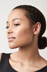 Image showing Black woman, profile and natural beauty with confidence and cosmetics in a studio. Isolated, white background and young face of a African female person and model relax with makeup and confidence