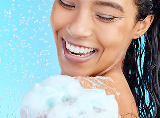 Image showing Shower, soap foam and black woman cleaning body with liquid for hydration wash, beauty healthcare or skincare hygiene. Self care studio, spa salon and happy model face isolated on blue background