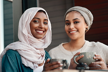 Image showing Friends, coffee and portrait of Muslim women in cafe for smile, food and social. Happy, relax and culture with arabic female customer in Dubai restaurant for drink, happiness and meeting