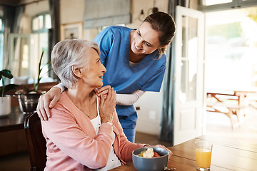 Image showing Healthcare, elderly woman with nurse with breakfast at her home and at the table in living room. Support or communication, caregiver and conversation with medical person with senior or old female.