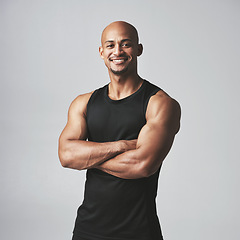 Image showing Fitness portrait happy man and arms crossed isolated on studio background, healthy body or muscle workout. Smile on face of strong athlete, USA bodybuilder or African person, exercise or sports power