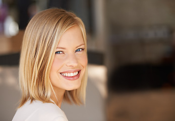 Image showing Young woman, smile and portrait with space for mockup, blurred background and happiness at workplace. Girl, mock up and copyspace for promotion, logo and happy with motivation, confidence or pride