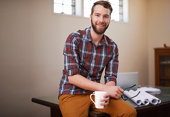 Image showing Portrait, employee and man in his workshop, business and blueprints with ideas, skills and coffee cup. Face, male entrepreneur and builder in his office, documents and paperwork with startup success