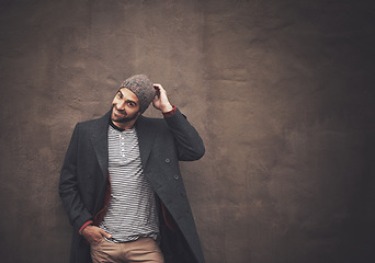 Image showing Portrait, fashion and man with a smile, stylish outfit or happiness against dark wall background. Face, happy male person or cool model with trendy clothes and aesthetic with style and mockup